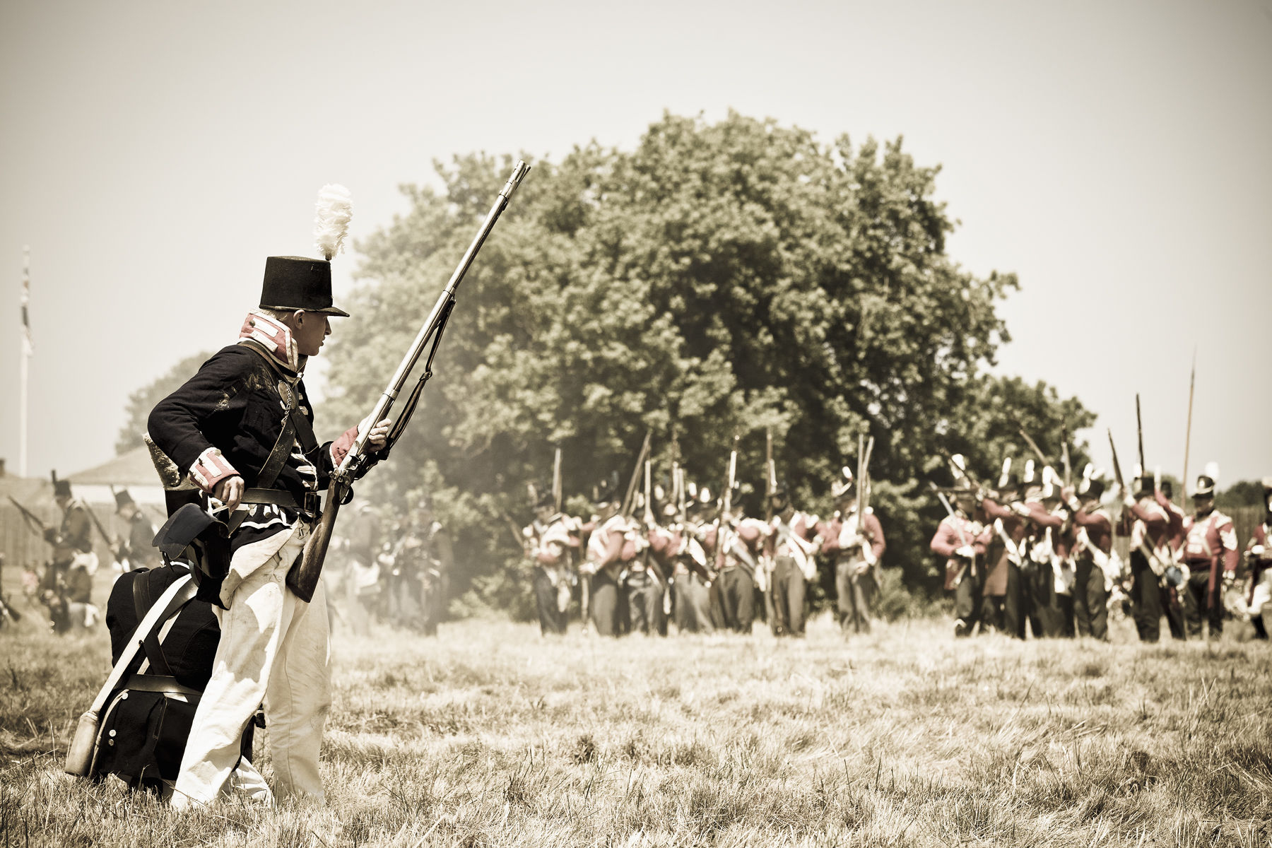 Canada, Ontario, Niagara-on-the-Lake, Fort George National Historic site Canada, Ontario, Niagara-on-the-Lake, Fort George National Historic site. War of 1812  re-enactors at Fort George, American soldier preparing to fire on British soldiers
