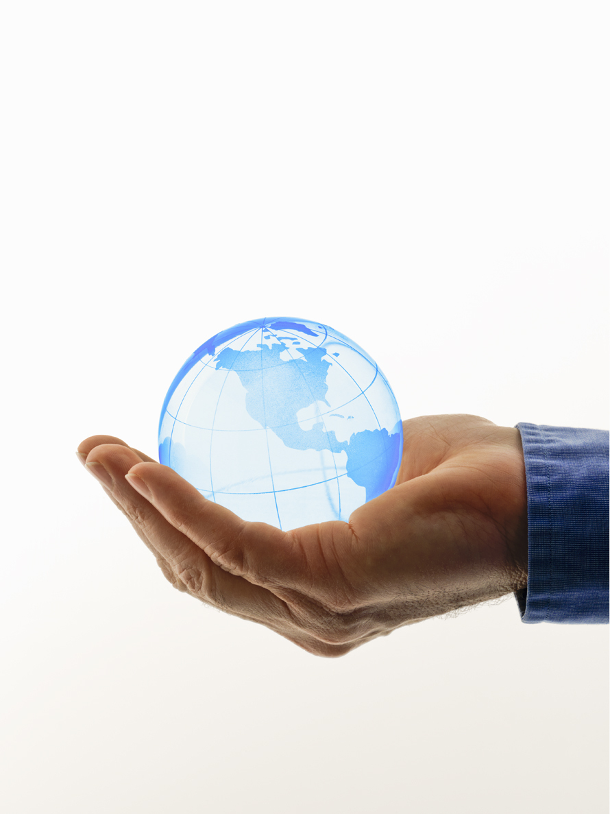 hand holding a crystal globe of the world. Getty Images #85072208 hand holding a crystal globe of the world