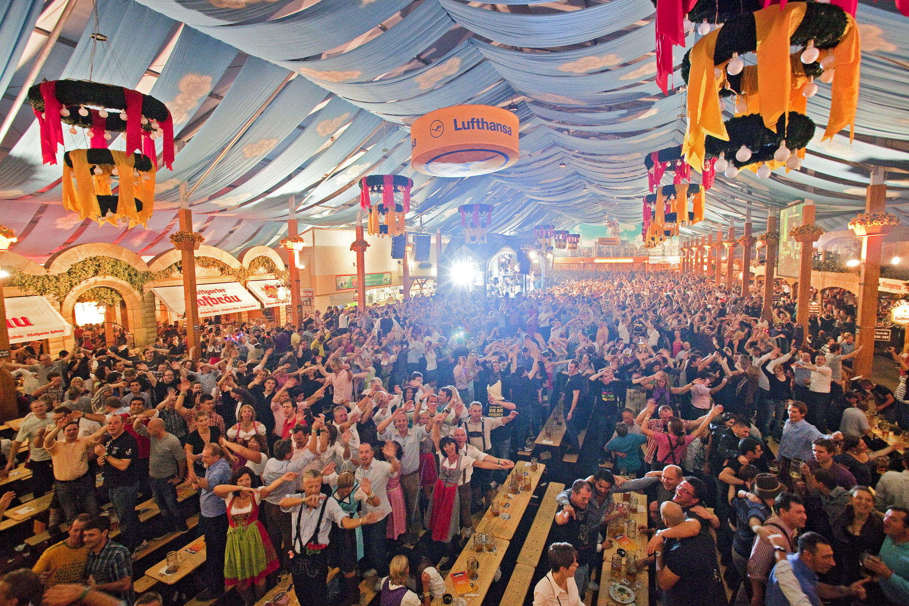 Germany,Cannstatter Wasn, Oktoberfest, people in beer tent. Getty Images #107866802 large group of people celebrating Oktoberfest