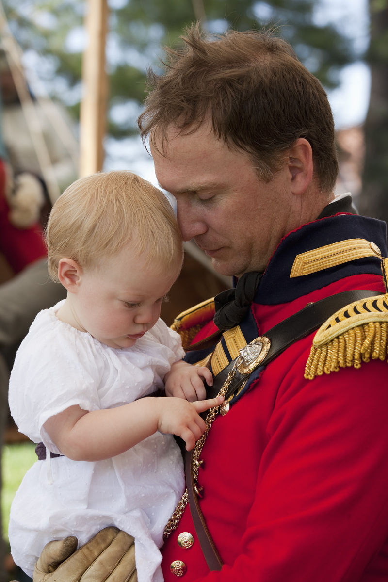 Canada,Ontario,Stoney Creek. Battlefield House, Battle of Stoney Creek 1812 re-enactment, British Officer holding baby war of 1812 re-enactment