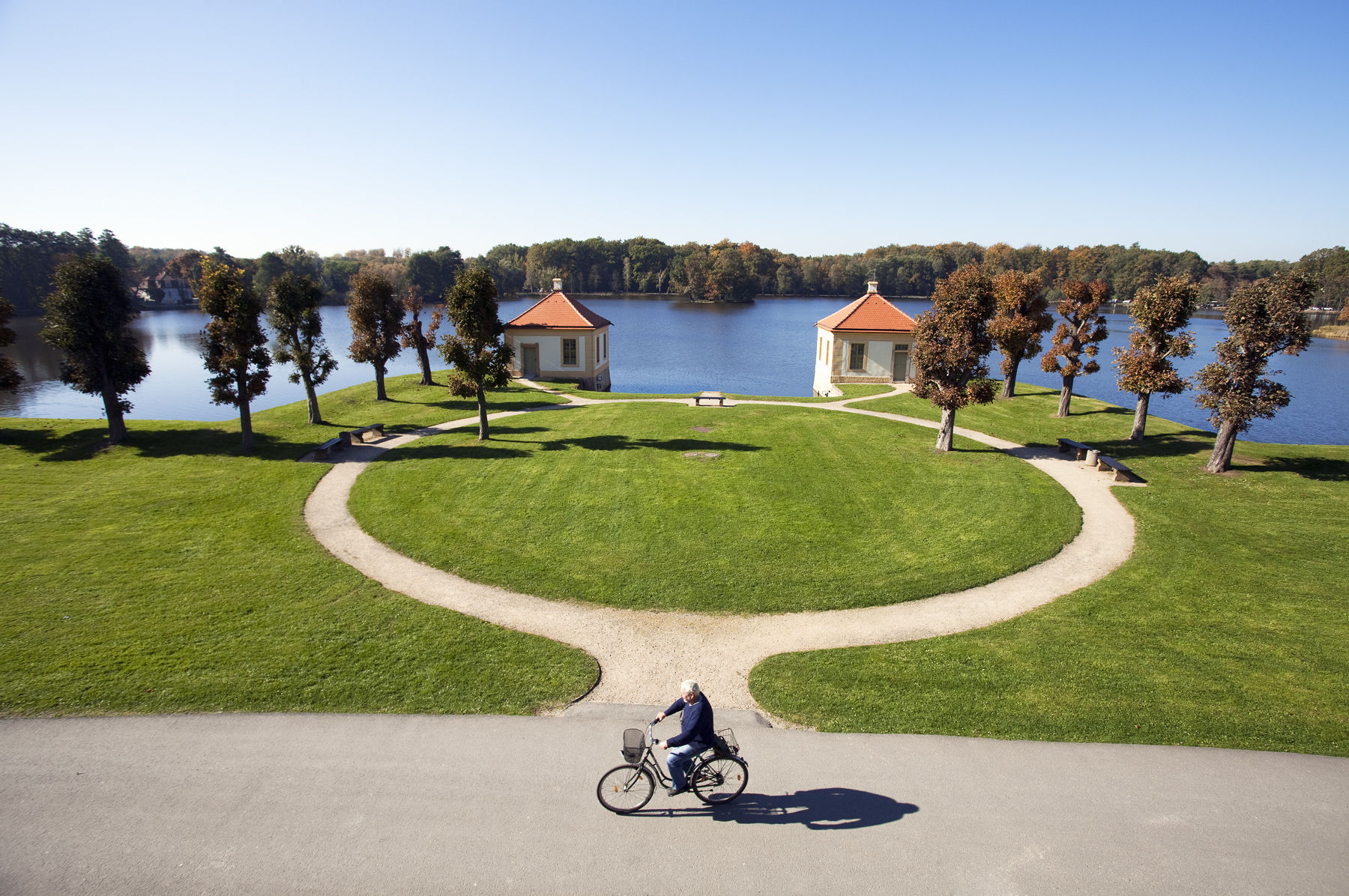 Germany,Saxony,Moritzburg, Moritzburg Castle, cyclist and gardens. Alamy # BY4MPY Moritzburg Castle, cyclist and gardens