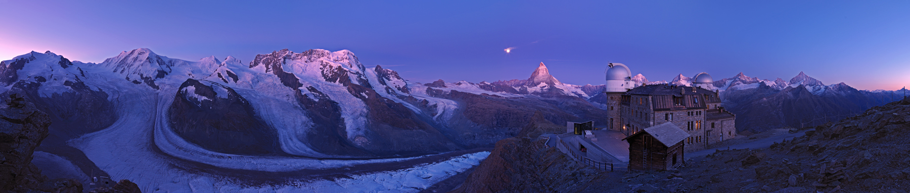 moon setting at dawn over the Matterhorn, the Gorner Glacier and Kulmhotel at the Gornergrat Switzerland Valais Zermatt Gornergrat