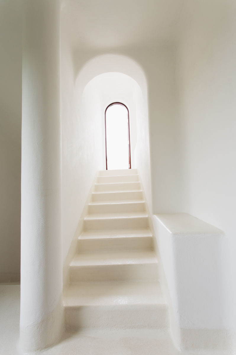 white adobe stair well steps leading to doorway