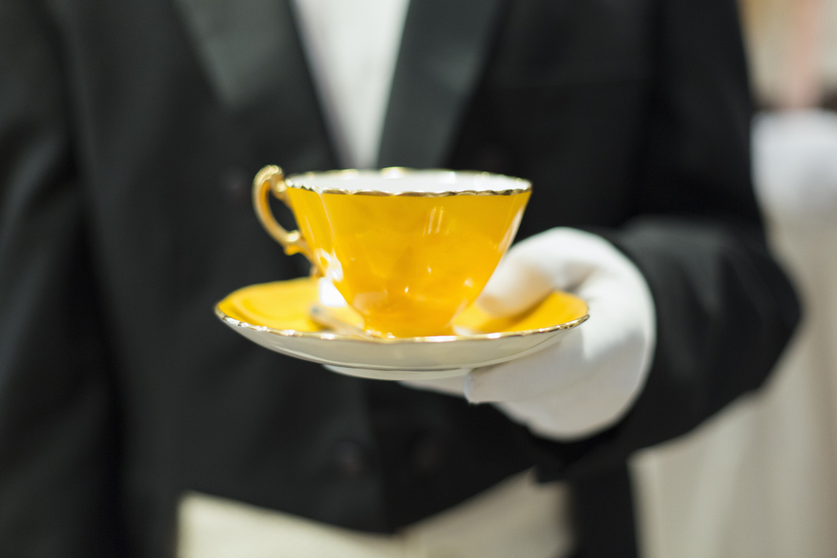 butler serving tea, white glove service. Alamy #D2E3FF butler serving tea