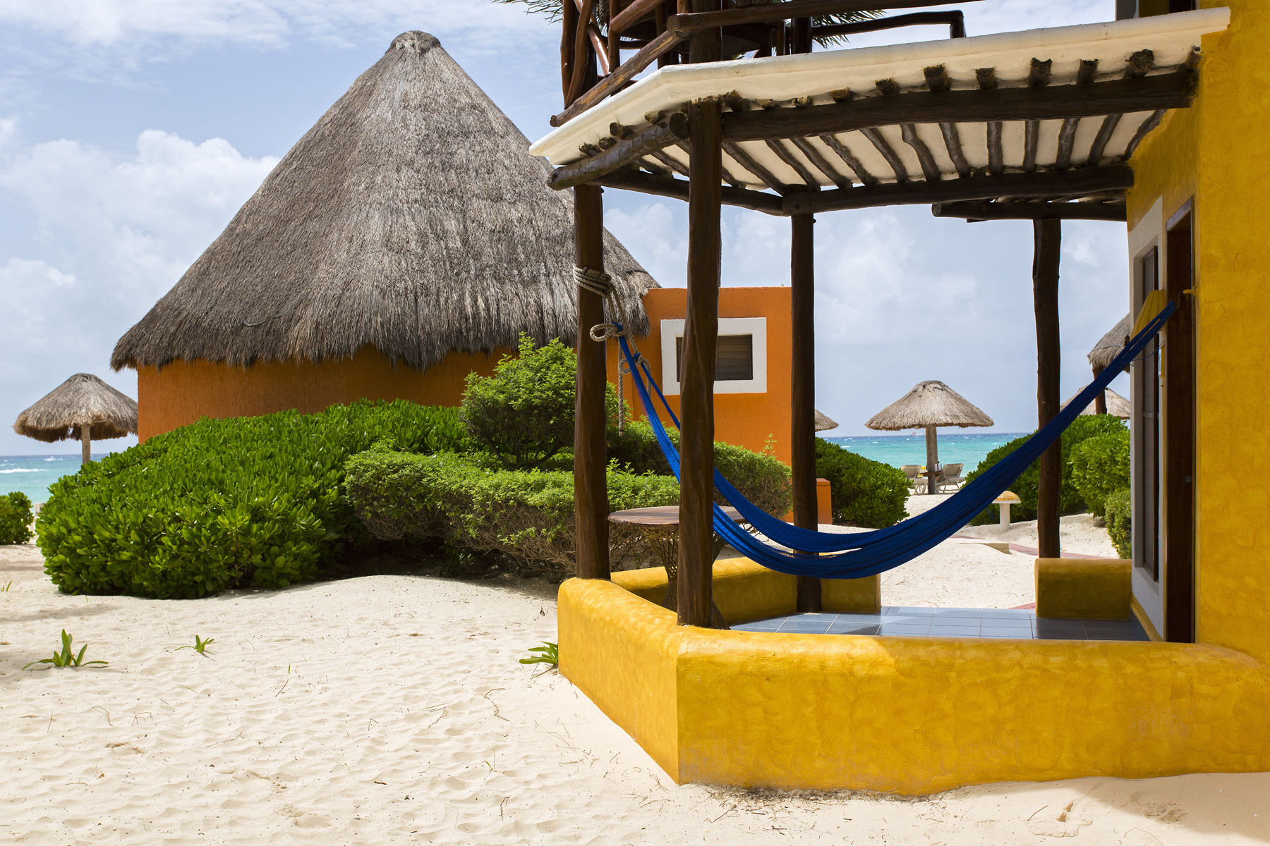 Mexico,Playa del Carmen,Mahekal Beach resort colorful palapa style accommodations at Mahekal Beach Resort