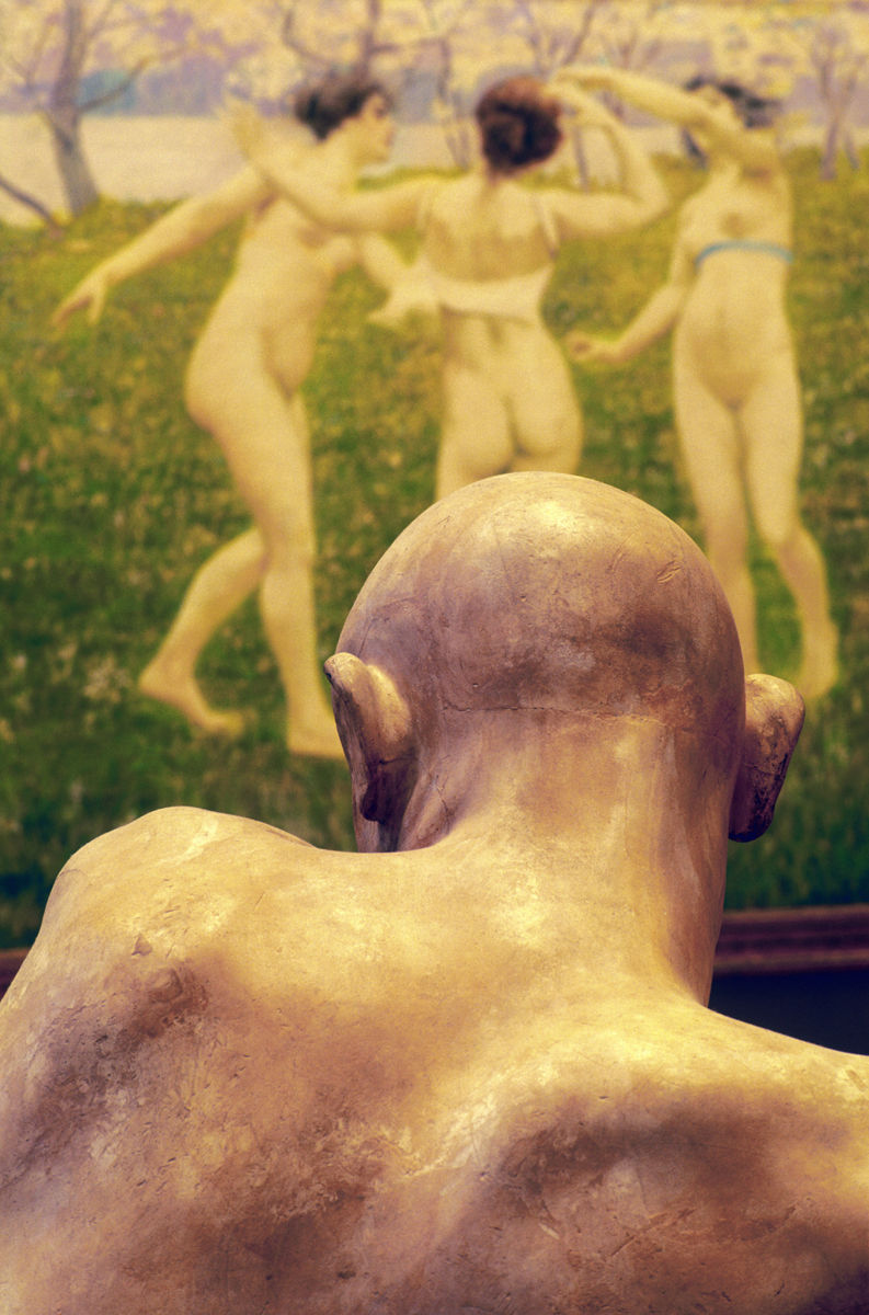 Italy,Venice,Ca'Pesaro, Gallery of Modern Art,view of the back of a sculpture's head and a painting of three girls dancing,the three graces. Alamy #AM45A3 sculptured head and a painting of three girls dancing