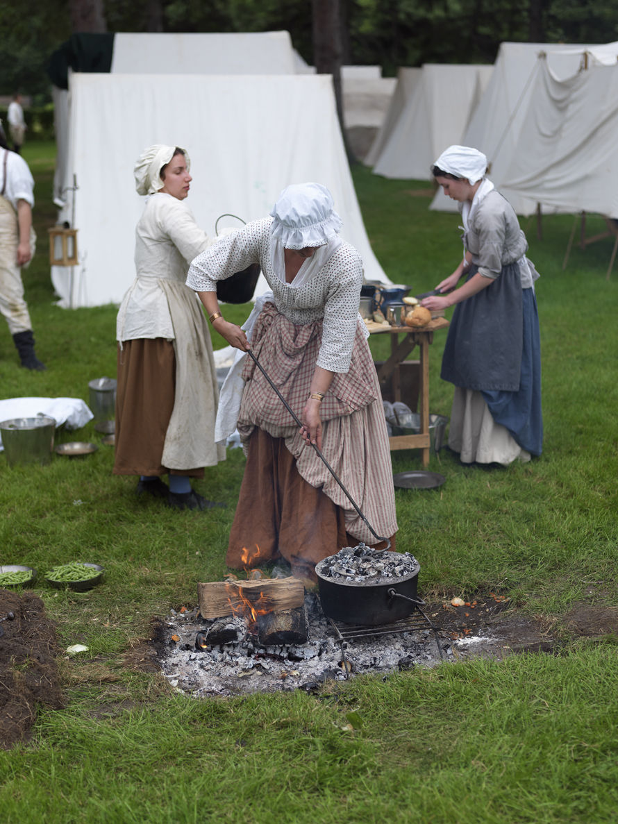 Canada, Ontario, Fort Erie, Old Fort Erie, War of 1812 re-enactors in period costume preparing meals over an open fire 1war_of_1812_27386