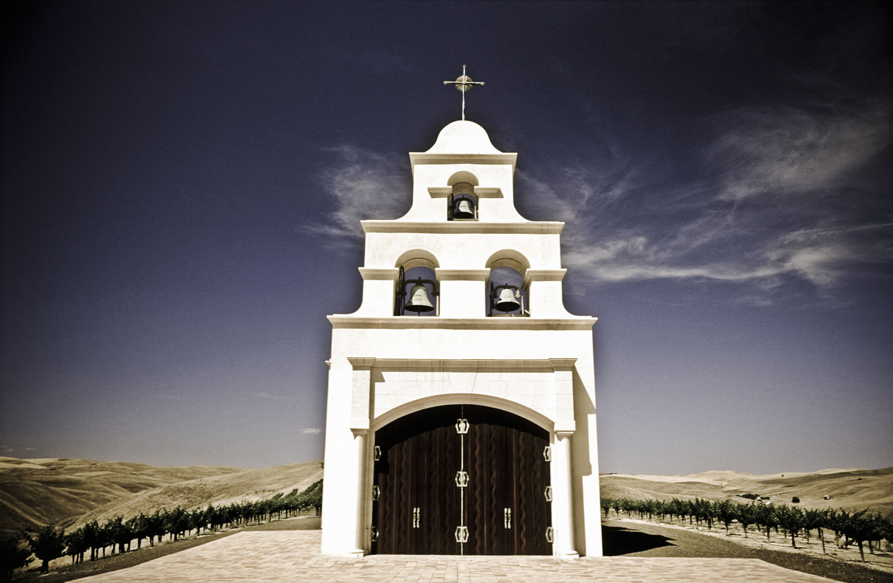 USA,California,Paso Robles,Spanish Mission style church on hill with grape vineyard USA,California,Paso Robles,Spanish Mission style church on hill