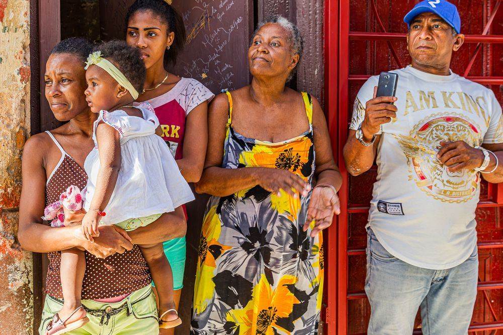 cuba_family_watching_our_lady_of_mercy.jpg