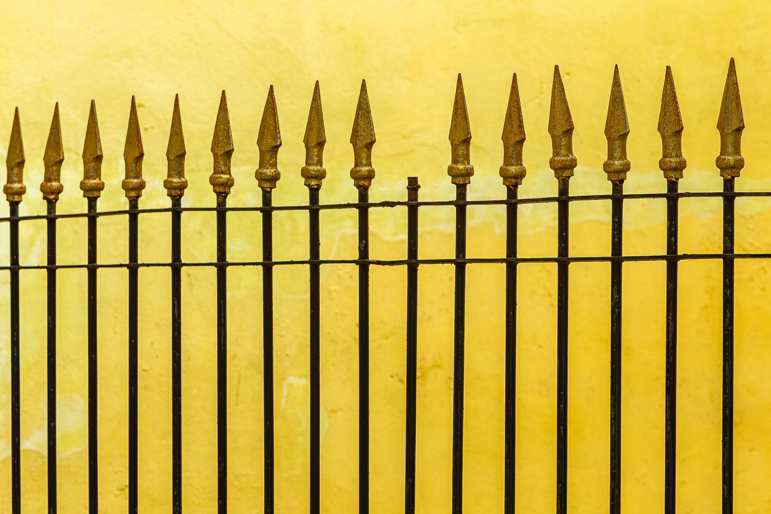 cuba_street_spear_fence_yellow_wall.jpg