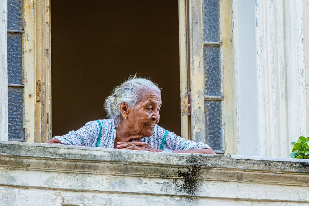 cuba_elderly_woman_procession_balcony.jpg
