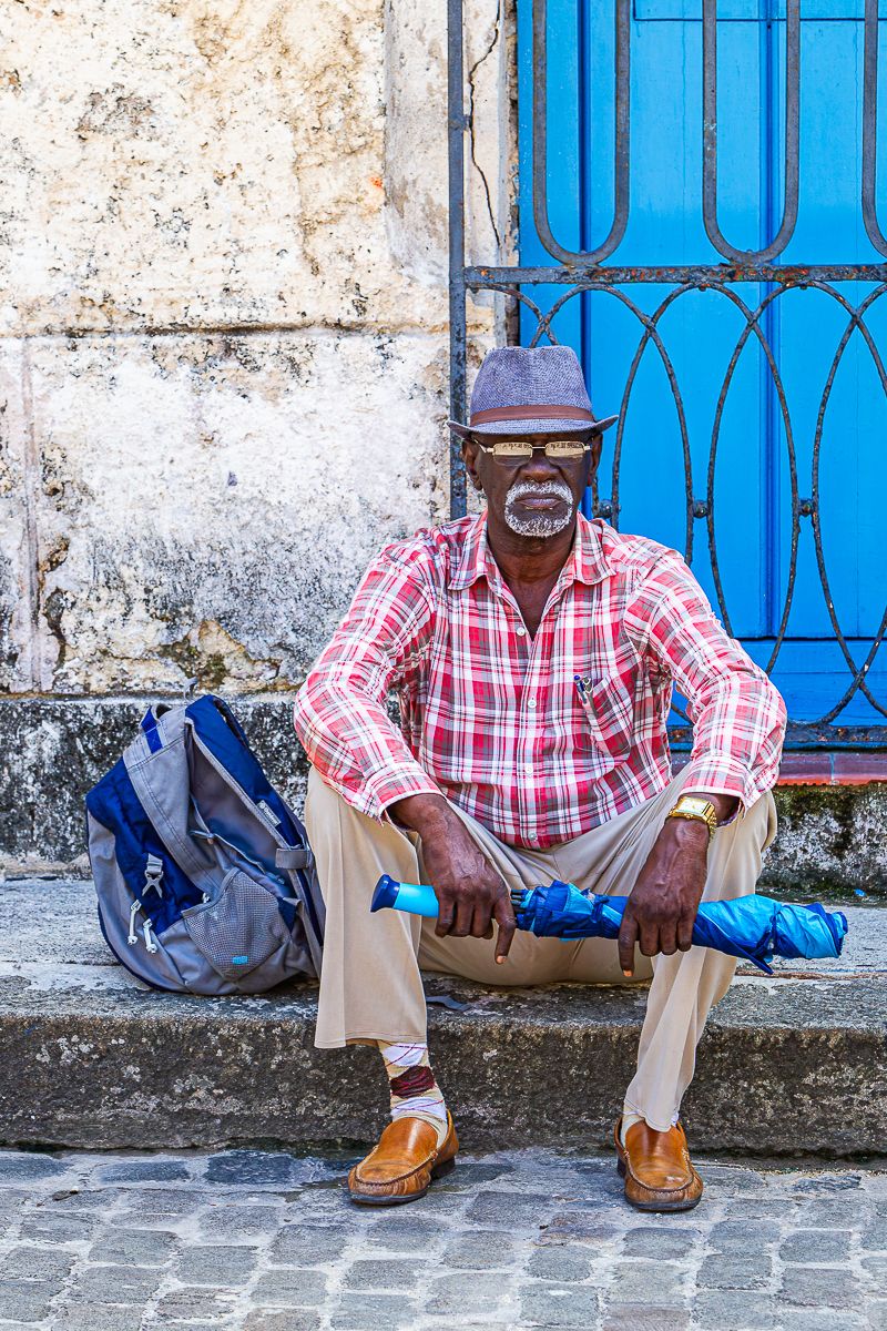 cuba_man_with_umbrella.jpg