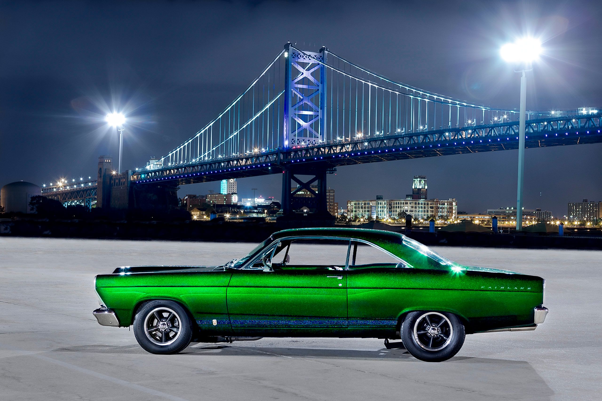 A flashy photograph of a PPG's Metallic Green auto paint used on this stunning 1966 Ford Fairlane. This profile image of the classic Ford has the Ben Franklin Bridge in the background. 1966 Ford Fairlane