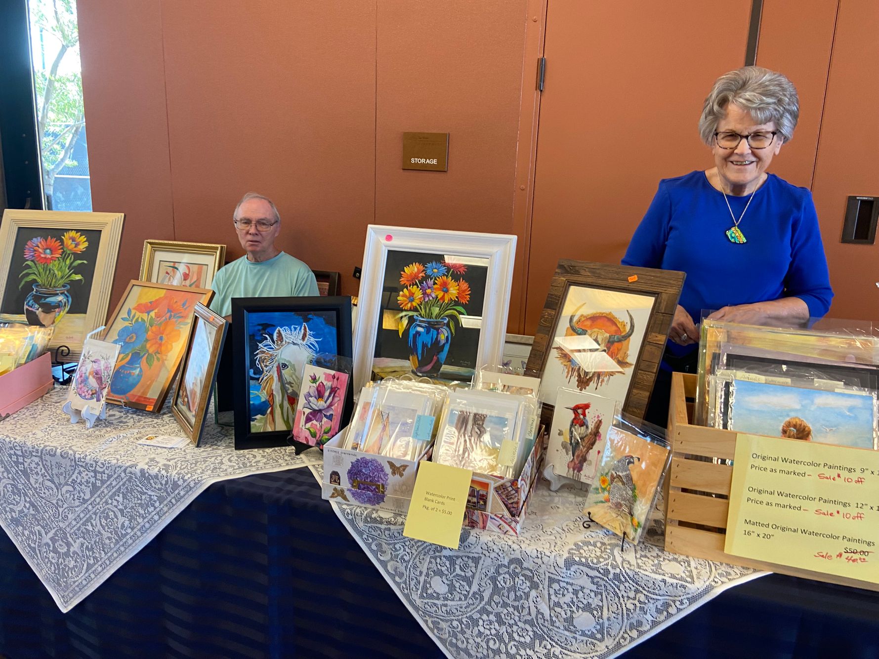 Don and Carol Rumley at Don's watercolor table.jpeg