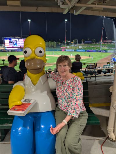 Teresa with Homer Simpson at the Isotopes Game.jpg