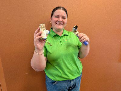 Claire McIntyre, Green Summit Account Manager, displays irrigation tubing invaded by roots..jpg