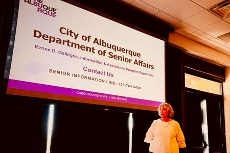 Photo by Catherine Carter, Carolyn Ajie introducing Senior Services speakers