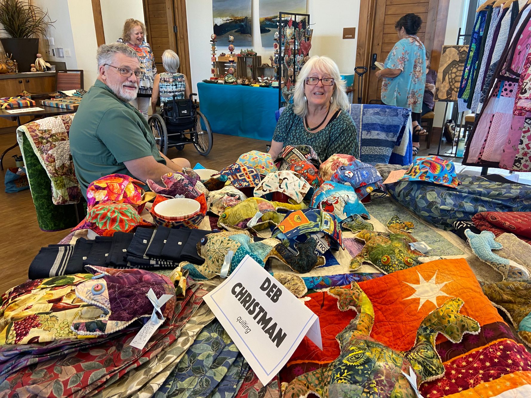 Roy and Deb Christman at Deb's quilting table.jpeg