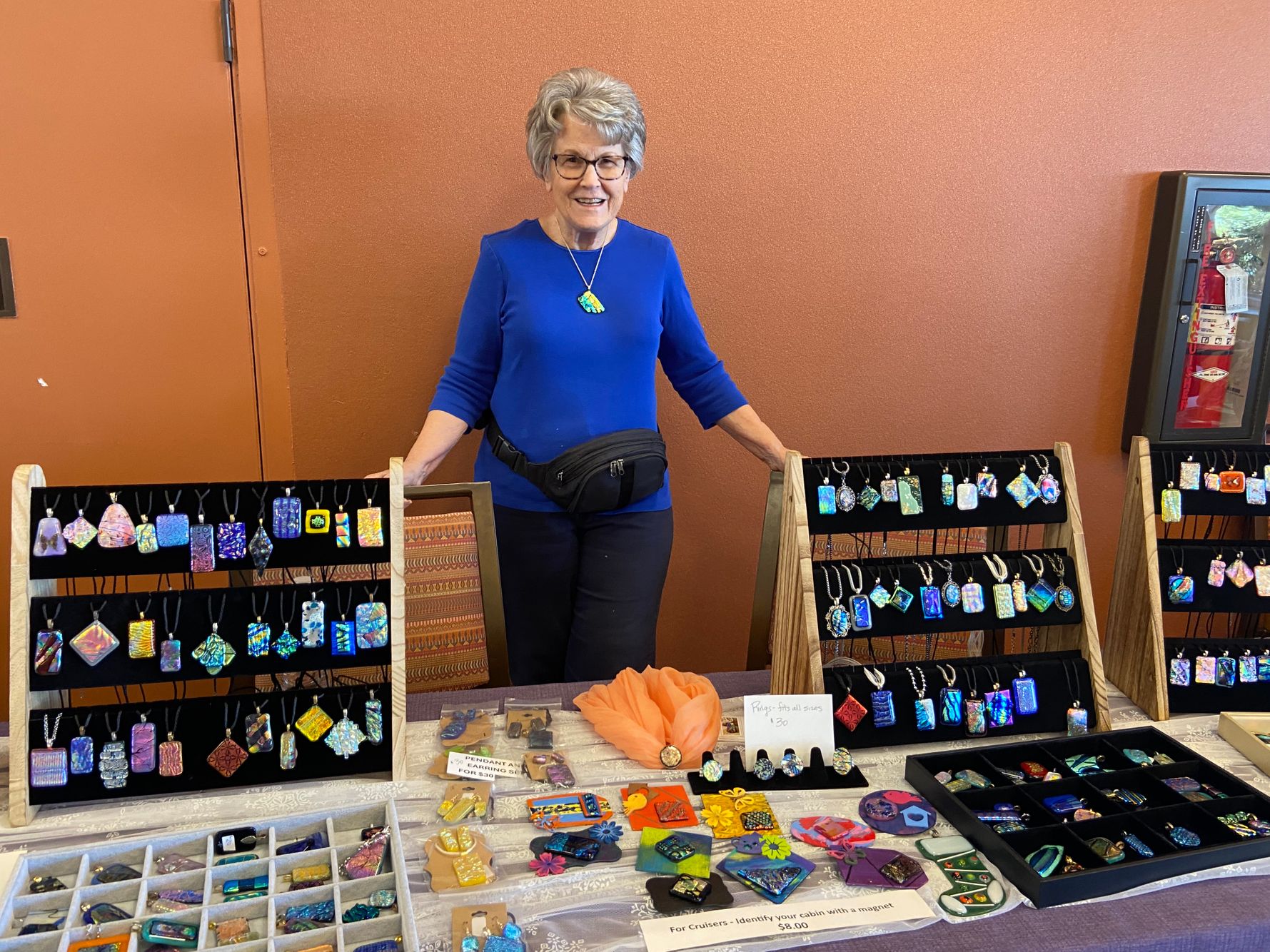 Carol Rumley at her fused glass table.jpeg