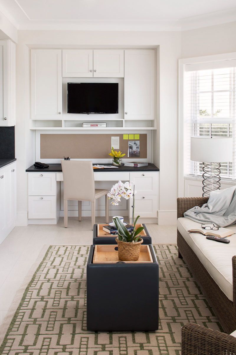 This oceanfront condominium was stripped to its concrete structure, and recreated with a new plan of three discreet zones: public rooms, master suite and guest quarters.  The public spaces flow together seamlessly for easy entertaining and maximum ocean exposure.  The cook's kitchen is outfitted for every possible need, and the matte glass wall tiles and marble rock floors in the bathrooms evoke beach glass glistening in the sand.Custom silk area rugs and Pierre Frey fabric curtains and upholstered furnishings were created especially for the project.New HVAC systems and hurricane resistant doors, windows and shutters were installed.Belsey & Mahla Architects provided both architectural and interior design services on this project completed in 2014. John's Island, Florida