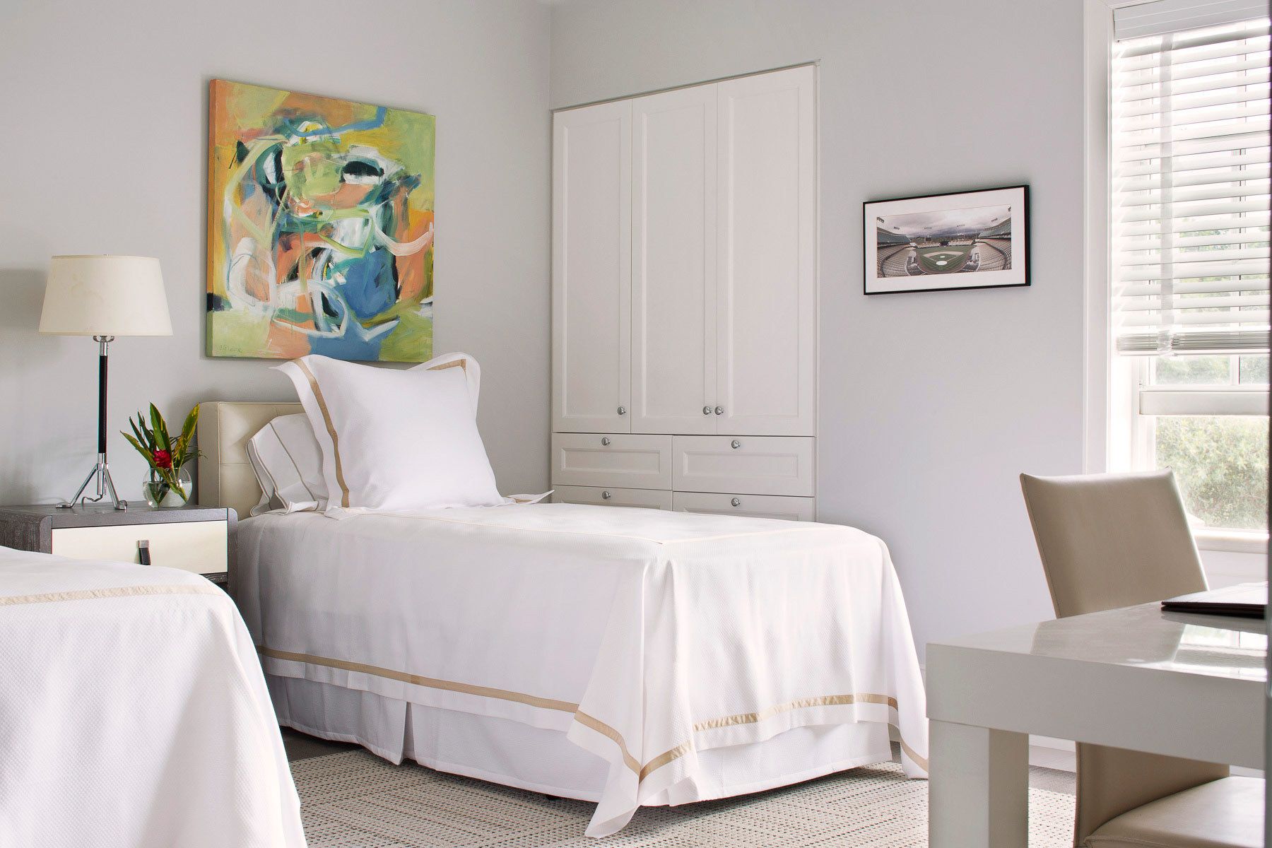 This oceanfront condominium was stripped to its concrete structure, and recreated wih a new plan of three discreet zones: public rooms, master suite and guest quarters.  The public spaces flow together seamlessly for easy entertaining and maximum ocean exposure.  The cook's kitchen is outfitted for every possible need, and the matte glass wall tiles and marble rock floors in the bathrooms evoke beach glass glistening in the sand.Custom silk area rugs and Pierre Frey fabric curtains and upholstered furnishings were created especially for the project.New HVAC systems and hurricane resistant doors, windows and shutters were installed.Belsey & Mahla Architects provided both architectural and interior design services on this project completed in 2014. John's Island, Florida