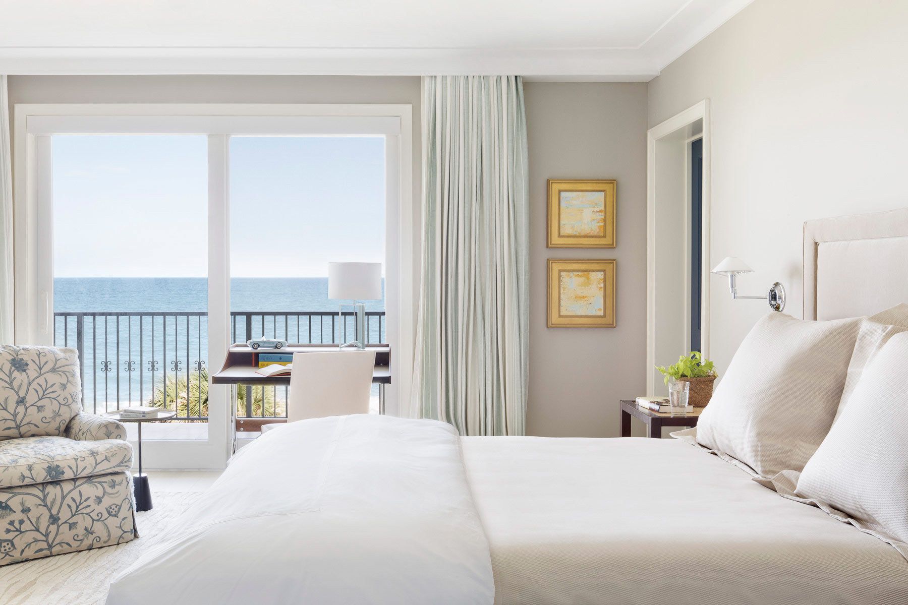 This oceanfront condominium was stripped to its concrete structure, and recreated with a new plan of three discreet zones: public rooms, master suite and guest quarters.  The public spaces flow together seamlessly for easy entertaining and maximum ocean exposure.  The cook's kitchen is outfitted for every possible need, and the matte glass wall tiles and marble rock floors in the bathrooms evoke beach glass glistening in the sand.Custom silk area rugs and Pierre Frey fabric curtains and upholstered furnishings were created especially for the project.New HVAC systems and hurricane resistant doors, windows and shutters were installed.Belsey & Mahla Architects provided both architectural and interior design services on this project completed in 2014. John's Island, Florida