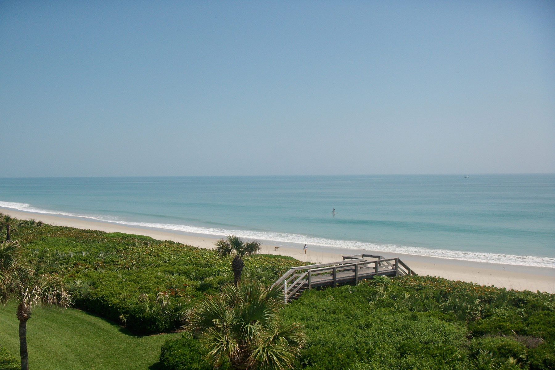 This oceanfront condominium was stripped to its concrete structure, and recreated with a new plan of three discreet zones: public rooms, master suite and guest quarters.  The public spaces flow together seamlessly for easy entertaining and maximum ocean exposure.  The cook's kitchen is outfitted for every possible need, and the matte glass wall tiles and marble rock floors in the bathrooms evoke beach glass glistening in the sand.Custom silk area rugs and Pierre Frey fabric curtains and upholstered furnishings were created especially for the project.New HVAC systems and hurricane resistant doors, windows and shutters were installed.Besley & Mahla Architects provided both architectural and interior design services on this project completed in 2014. John's Island, Florida