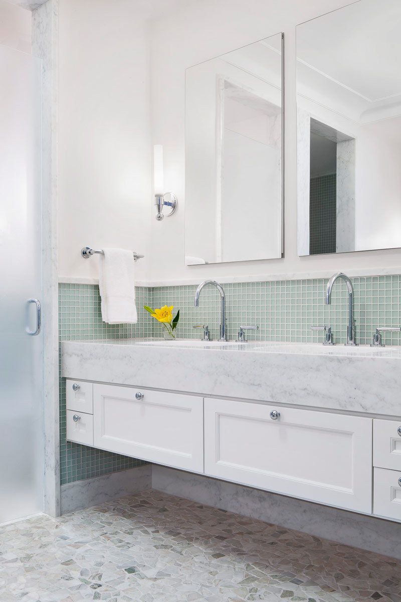 This oceanfront condominium was stripped to its concrete structure, and recreated with a new plan of three discreet zones: public rooms, master suite and guest quarters.  The public spaces flow together seamlessly for easy entertaining and maximum ocean exposure.  The cook's kitchen is outfitted for every possible need, and the matte glass wall tiles and marble rock floors in the bathrooms evoke beach glass glistening in the sand.Custom silk area rugs and Pierre Frey fabric curtains and upholstered furnishings were created especially for the project.New HVAC systems and hurricane resistant doors, windows and shutters were installed.Belsey & Mahla Architects provided both architectural and interior design services on this project completed in 2014. John's Island, Florida