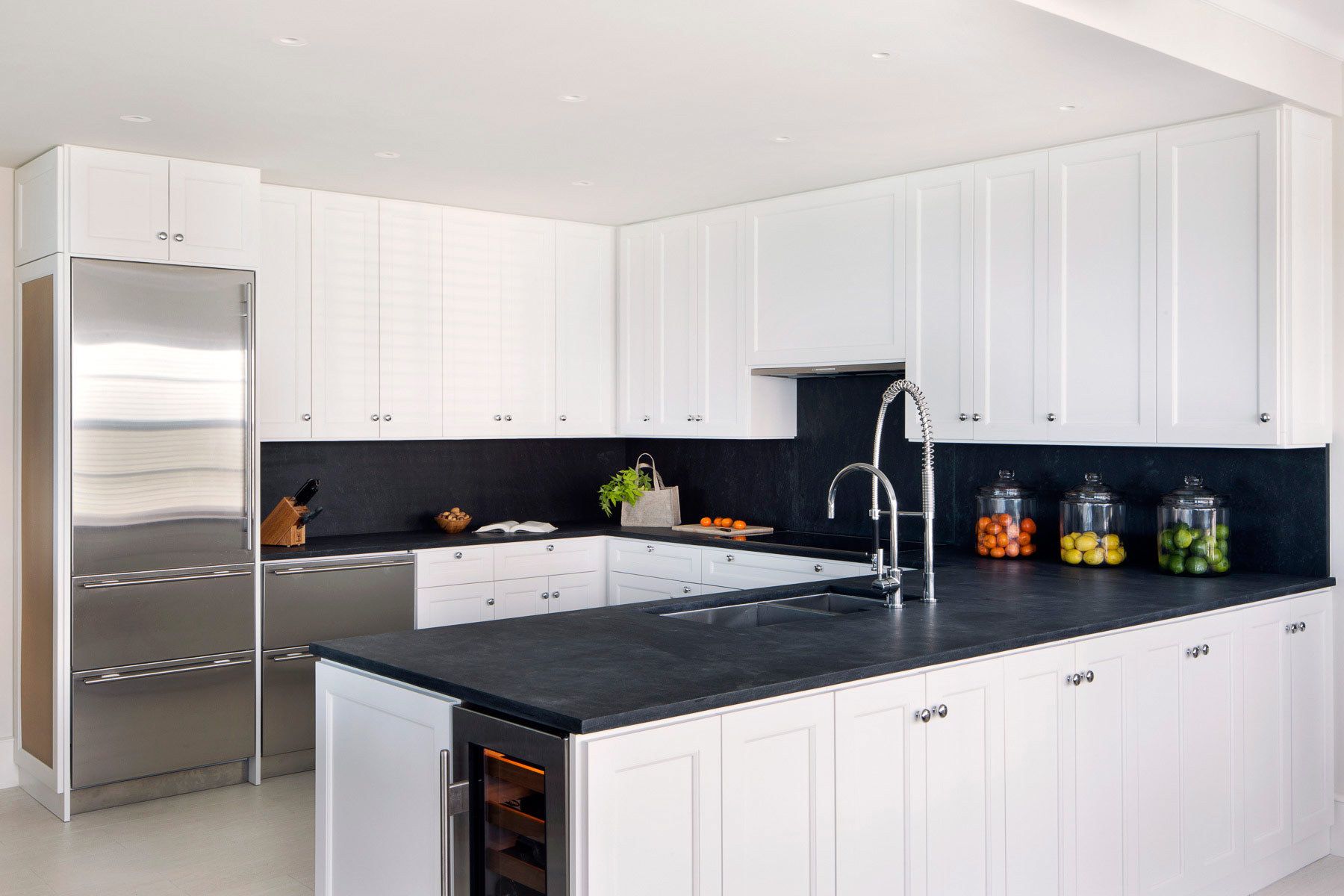 This oceanfront condominium was stripped to its concrete structure, and recreated with a new plan of three discreet zones: public rooms, master suite and guest quarters.  The public spaces flow together seamlessly for easy entertaining and maximum ocean exposure.  The cook's kitchen is outfitted for every possible need, and the matte glass wall tiles and marble rock floors in the bathrooms evoke beach glass glistening in the sand.Custom silk area rugs and Pierre Frey fabric curtains and upholstered furnishings were created especially for the project.New HVAC systems and hurricane resistant doors, windows and shutters were installed.Belsey & Mahla Architects provided both architectural and interior design services on this project completed in 2014. John's Island, Florida