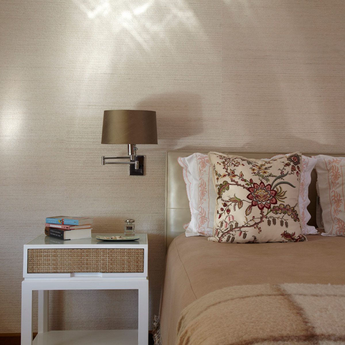 This apartment renovation features rich nut-wood veneers, walnut for the doors and pecan for the kitchen cabinetry, complemented with outsized patterned wallpaper in the entry vestibule and den.  The gallery is furnished with a Serge Mouille chandelier casting light on the silver leafed ceiling, a bronze wall-mounted BDDW vacuum tube clock, and a shagreen-fronted Roman Thomas console.Construction was completed in 2006, and Belsey & Mahla Architects continues to provide design services to the owners. West 86th Street