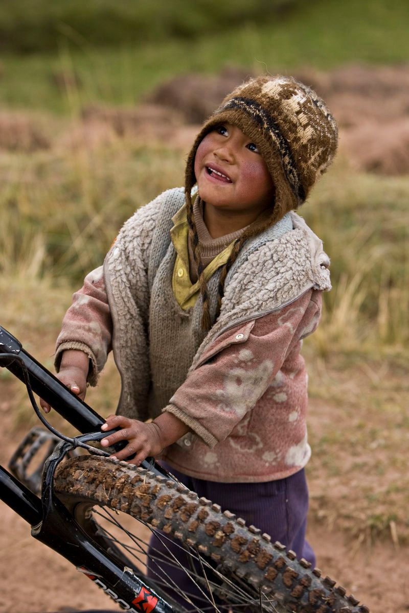 Young Peruvian boy with mountain bike near Cusco