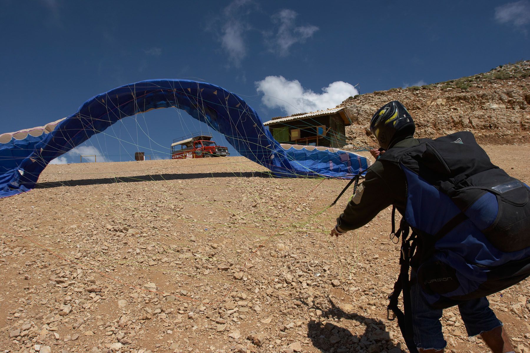 Prepping the chute for paragliding above Oludeniz