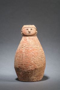 Red Pottery Bottle With Human Head