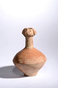 Red Pottery Bottle With Human Head