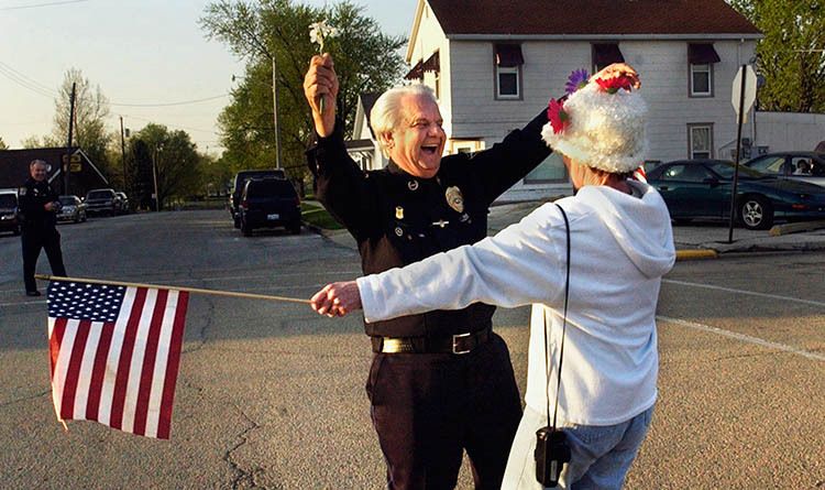 Delavan Police Chief Tom Vonachen, left, greets well-wisher JoAnn Beymer before a parade in honor of his retirement. 1Vonachen_retirement_copy