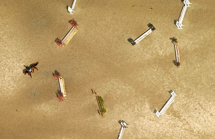 A horse and rider complete a jumping course as seen from the air near Isle of Wight County in southeastern Virginia. 1horseback_aerial_copy