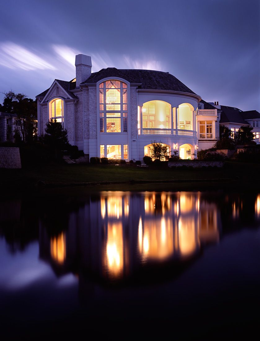 Exterior dusk architectural photograph with lights reflecting in water