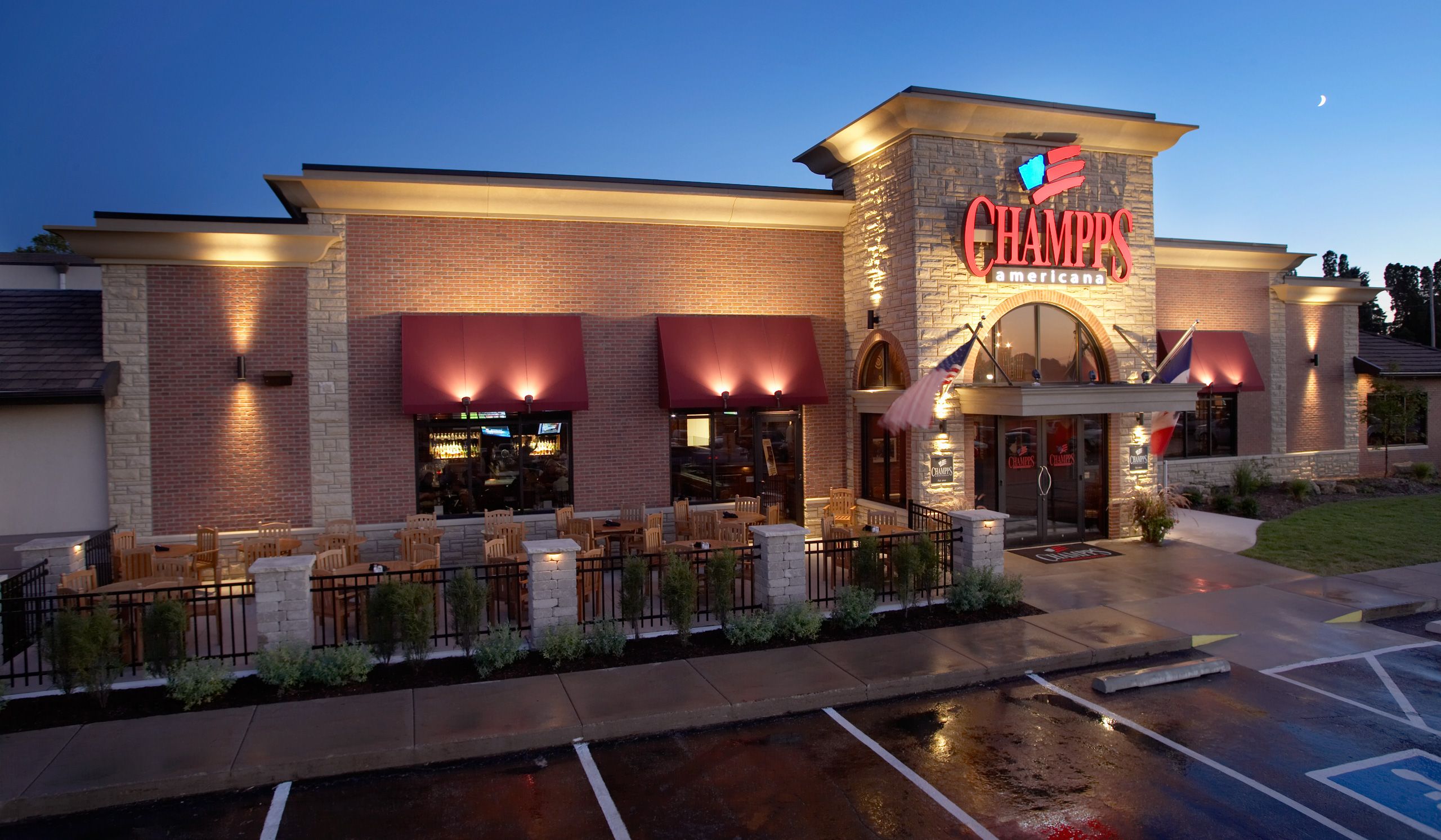 The front of Champps Americana Restaurant  at dusk