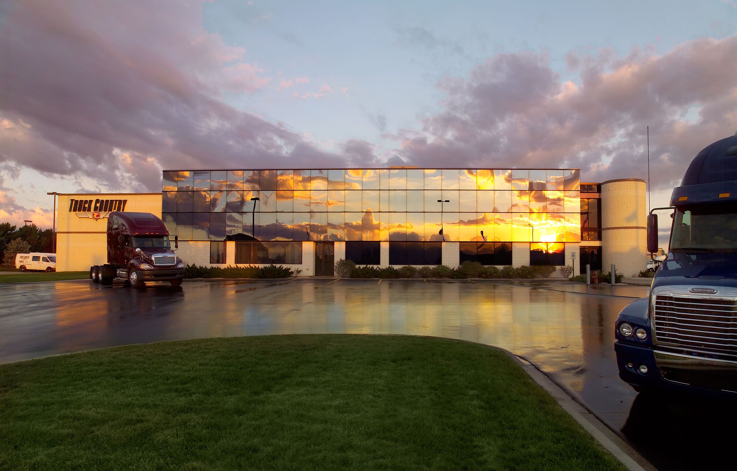Exterior architectural photograph Truck Country sunset reflecting in windows