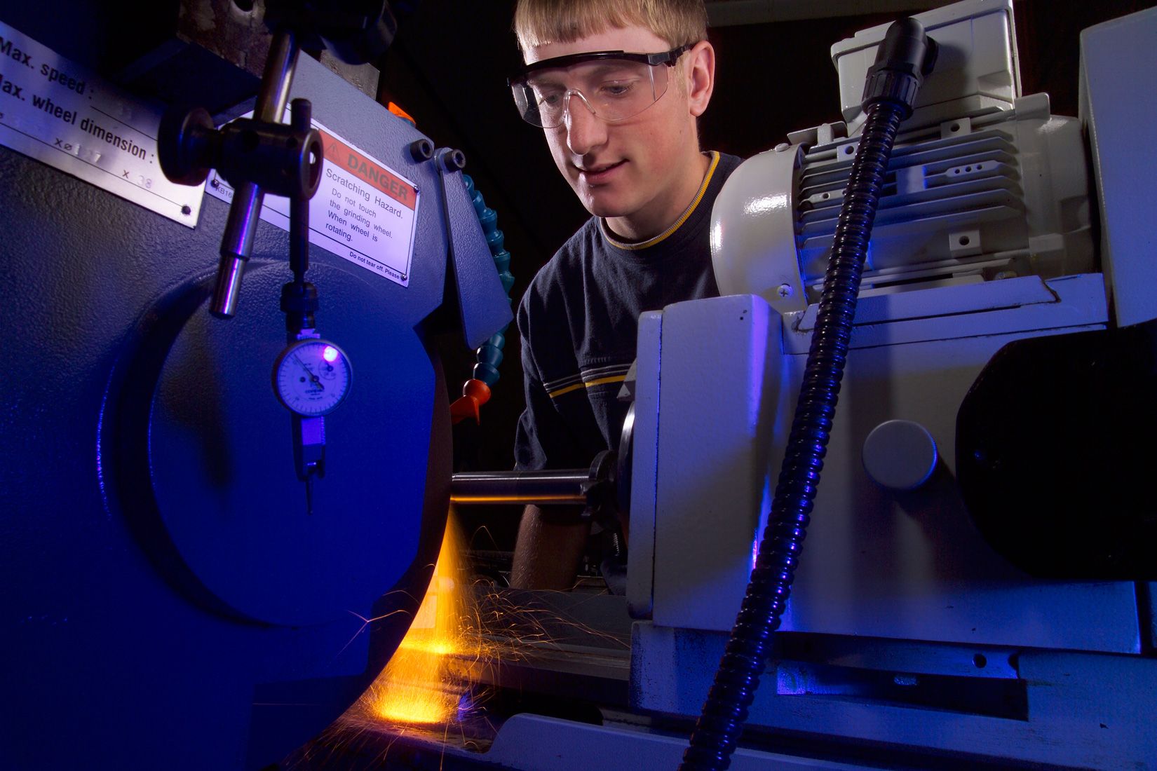 Student using a CNC machine during class at Hawkeye Community College