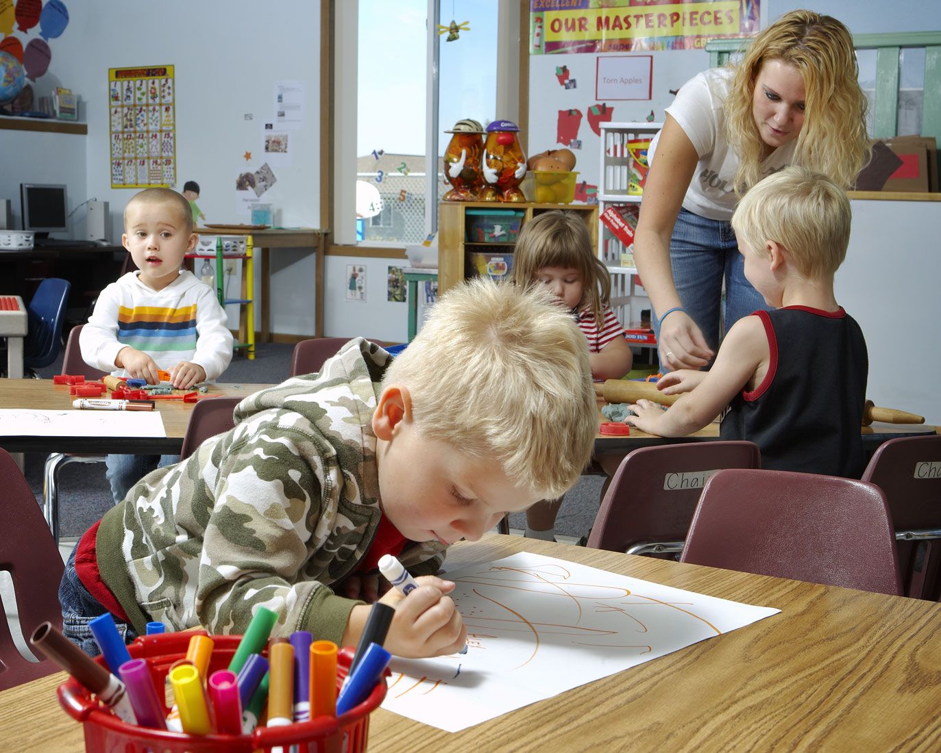Children and teacher at daycare on campus at Hawkeye Community College
