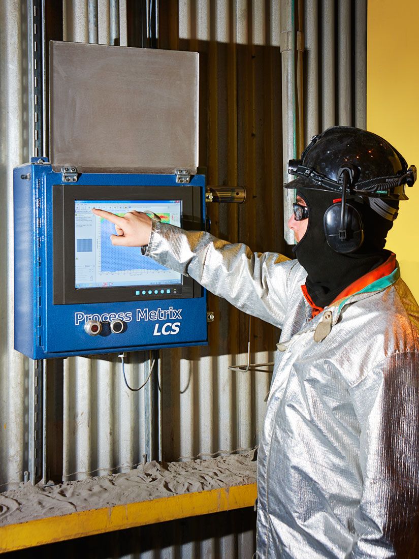 Worker in foundry in flame retardent suit