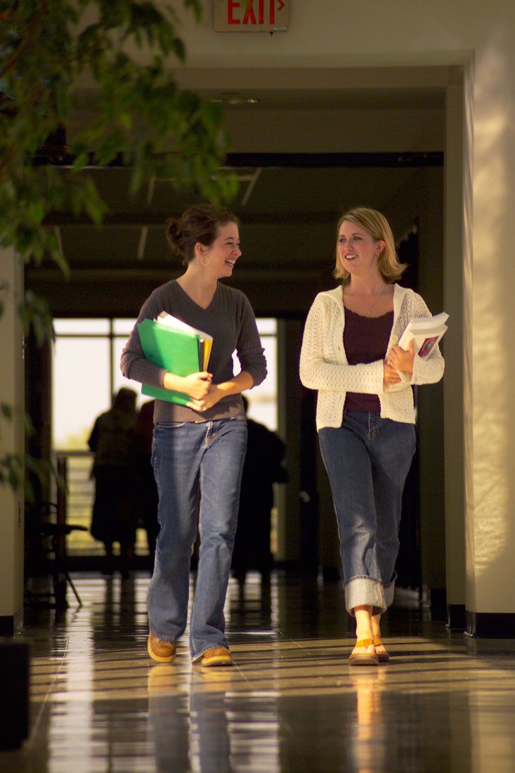 Students walking down a hallway at Hawkeye Community College