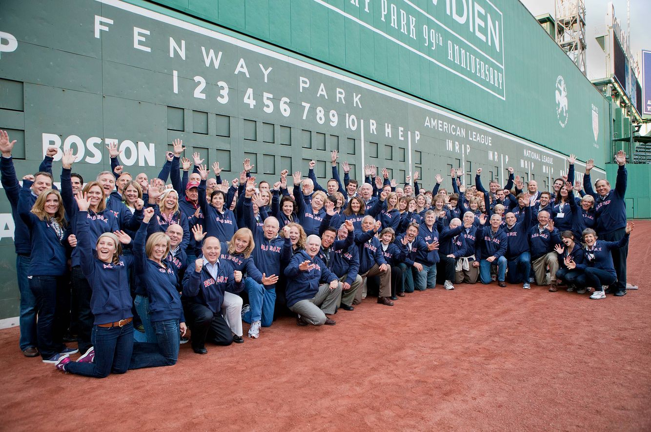 Group Picture in front of the Green Monster Wall at Fenway Park