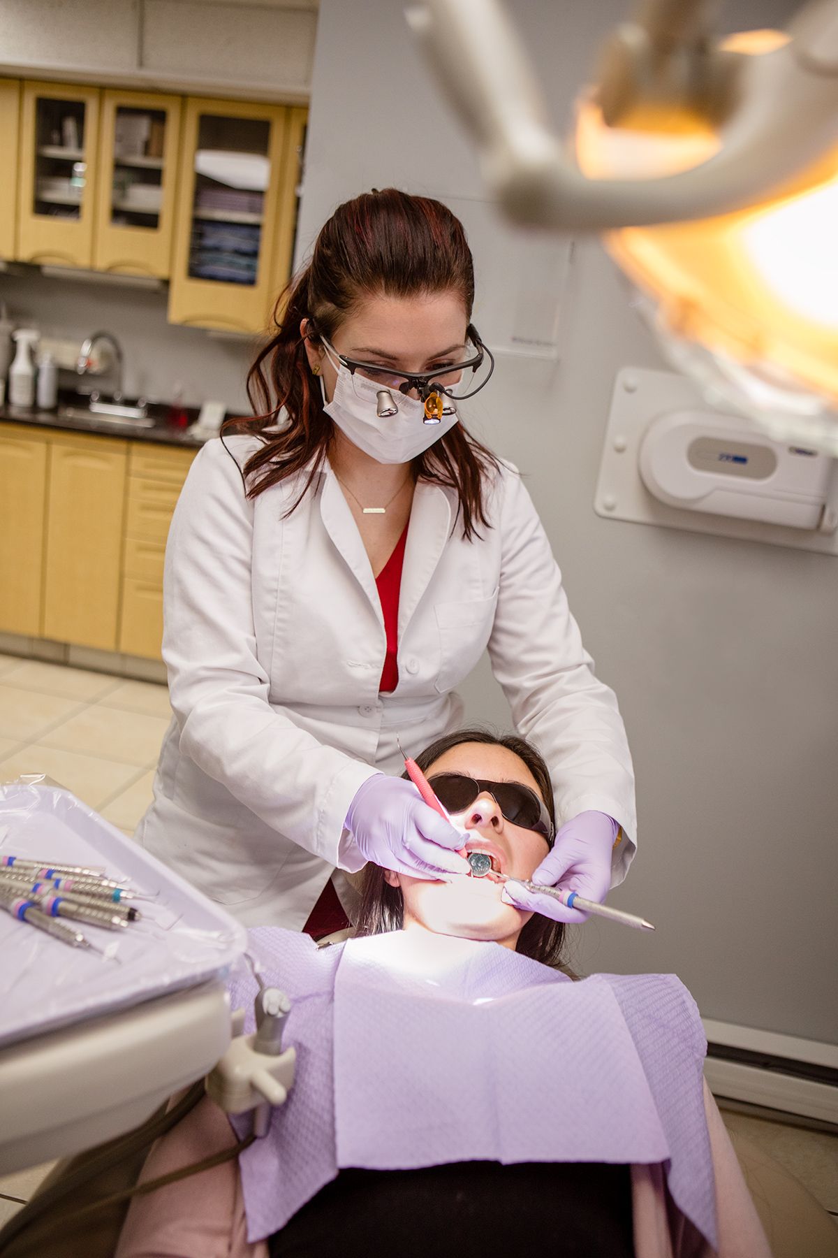 Dental Hygienist Working on a Patient