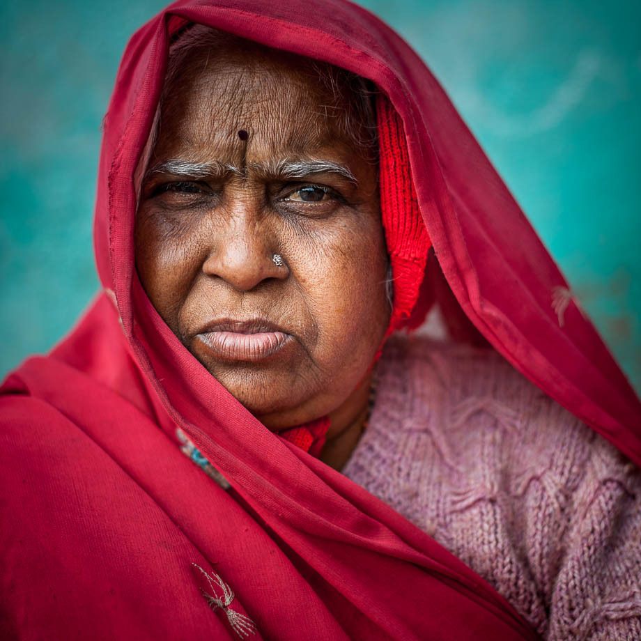 1frowning_woman_in_red_veil_square_portrait_udaipur_india