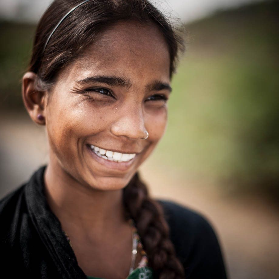 1young_woman_smiling_in_black_udaipur_india