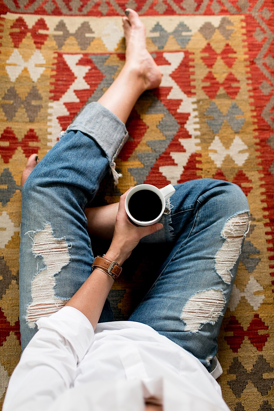 Holding coffee on a rug