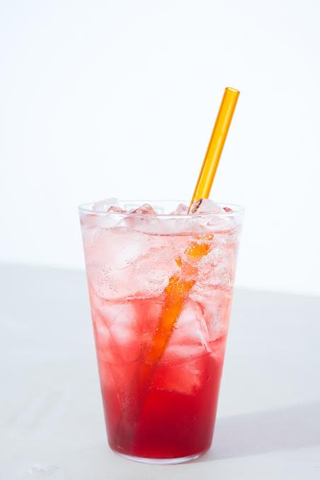 Pink ombre soda with yellow straw