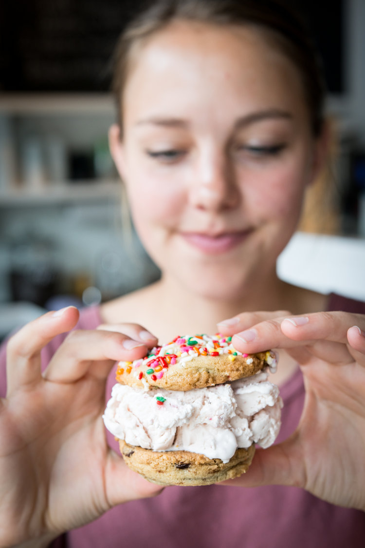 Person shows cookie sandwich to camera 